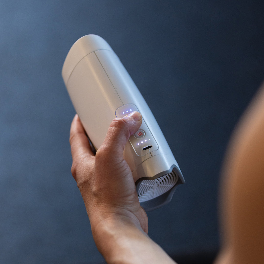 The Cryo-1 palm cooling device held in a hand
